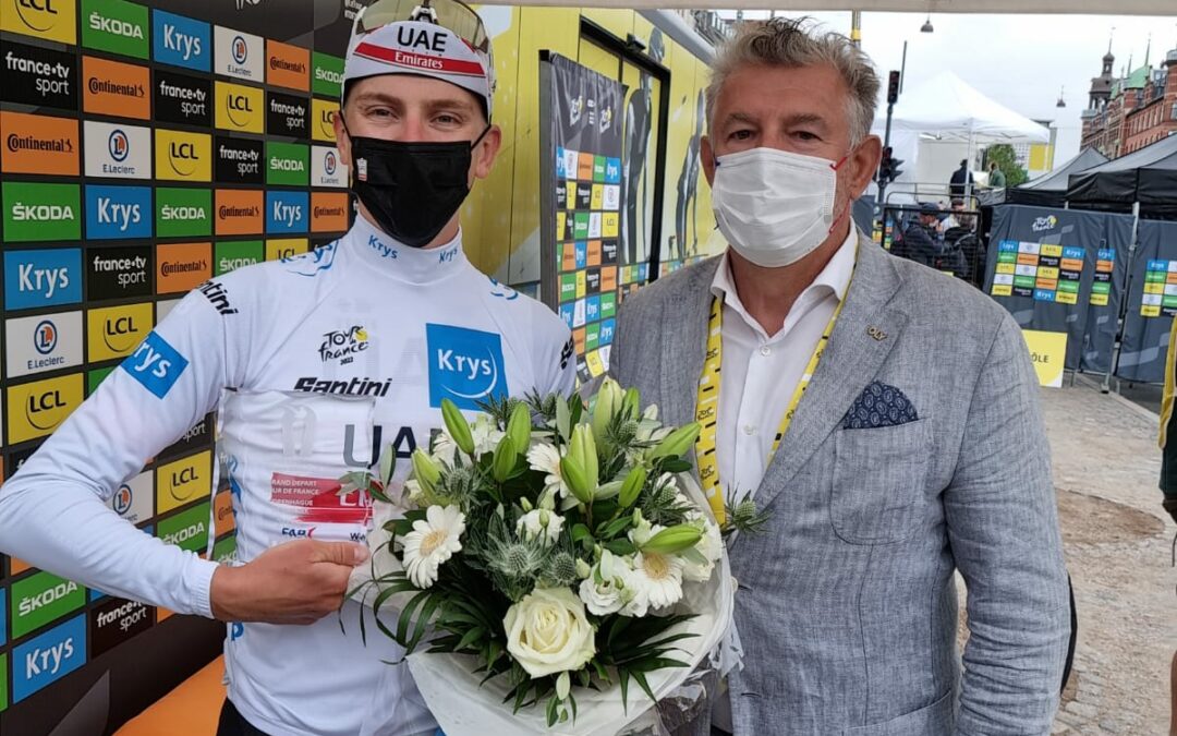 Peace and Sport presents the white jersey and the WhiteCard trophy to Tadej Pogacar during the 1st stage of the Tour de France